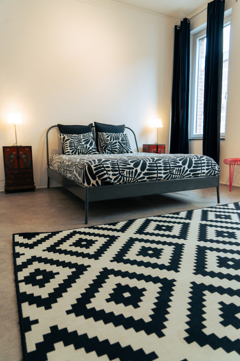 La chambre à coucher de l'appartement Lyves 2, situé au 1er étage du 50 à Liège (4000) en Belgique